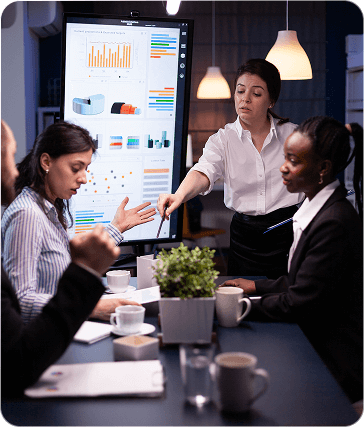 Business team analyzing CRM dashboard with charts